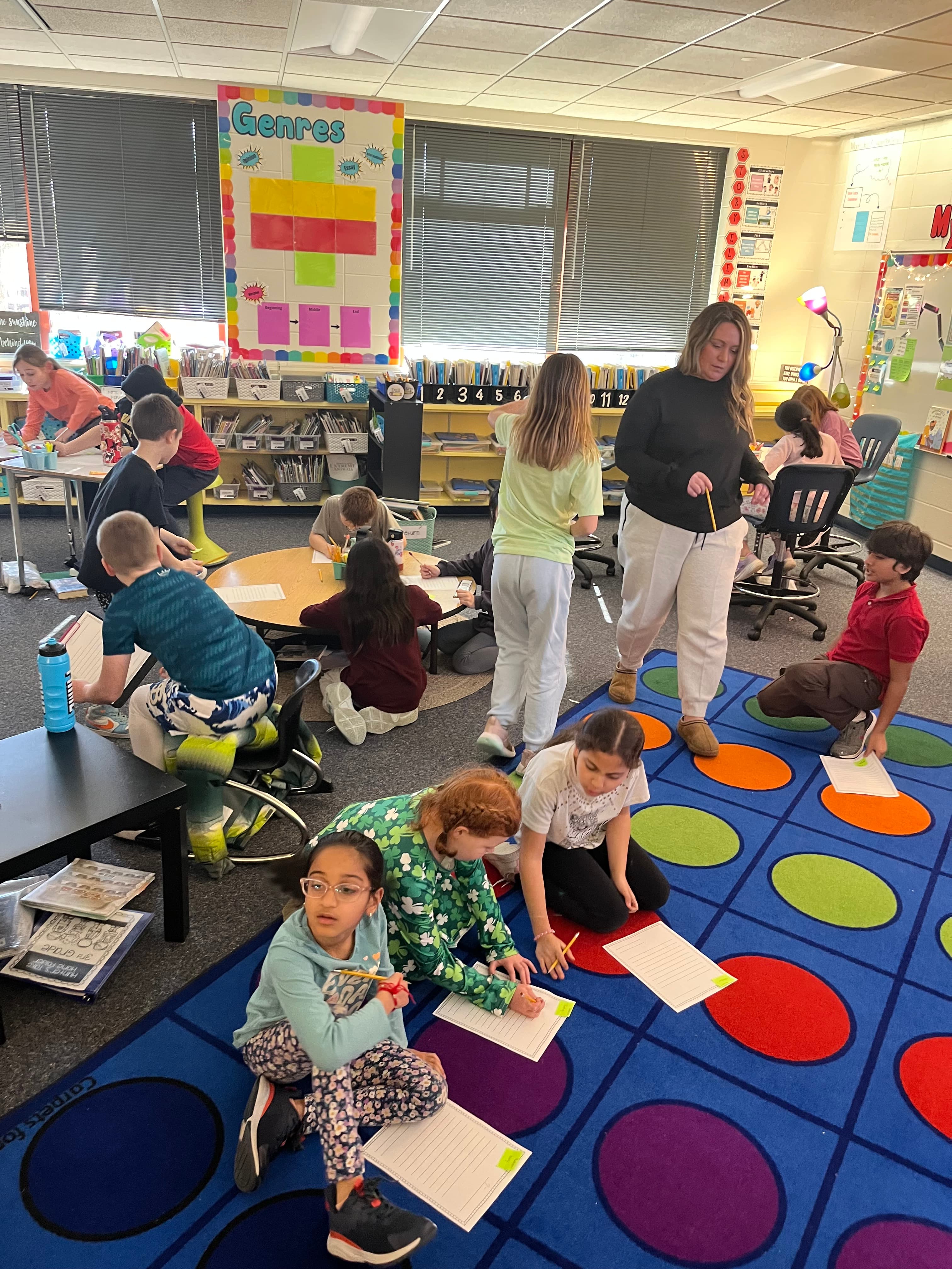 Kids in classroom holding papers