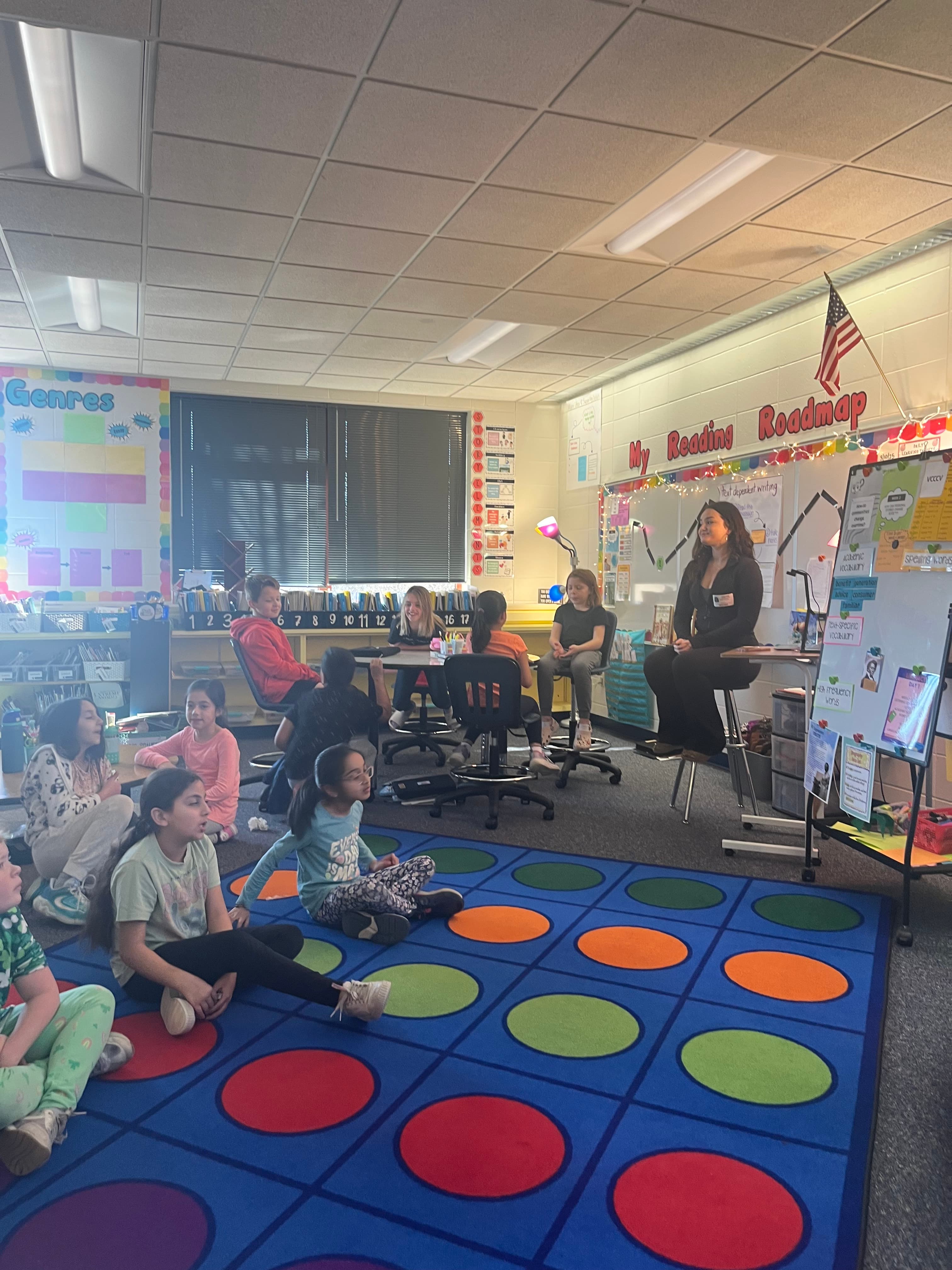 Teacher leading a letter-writing lesson with kids