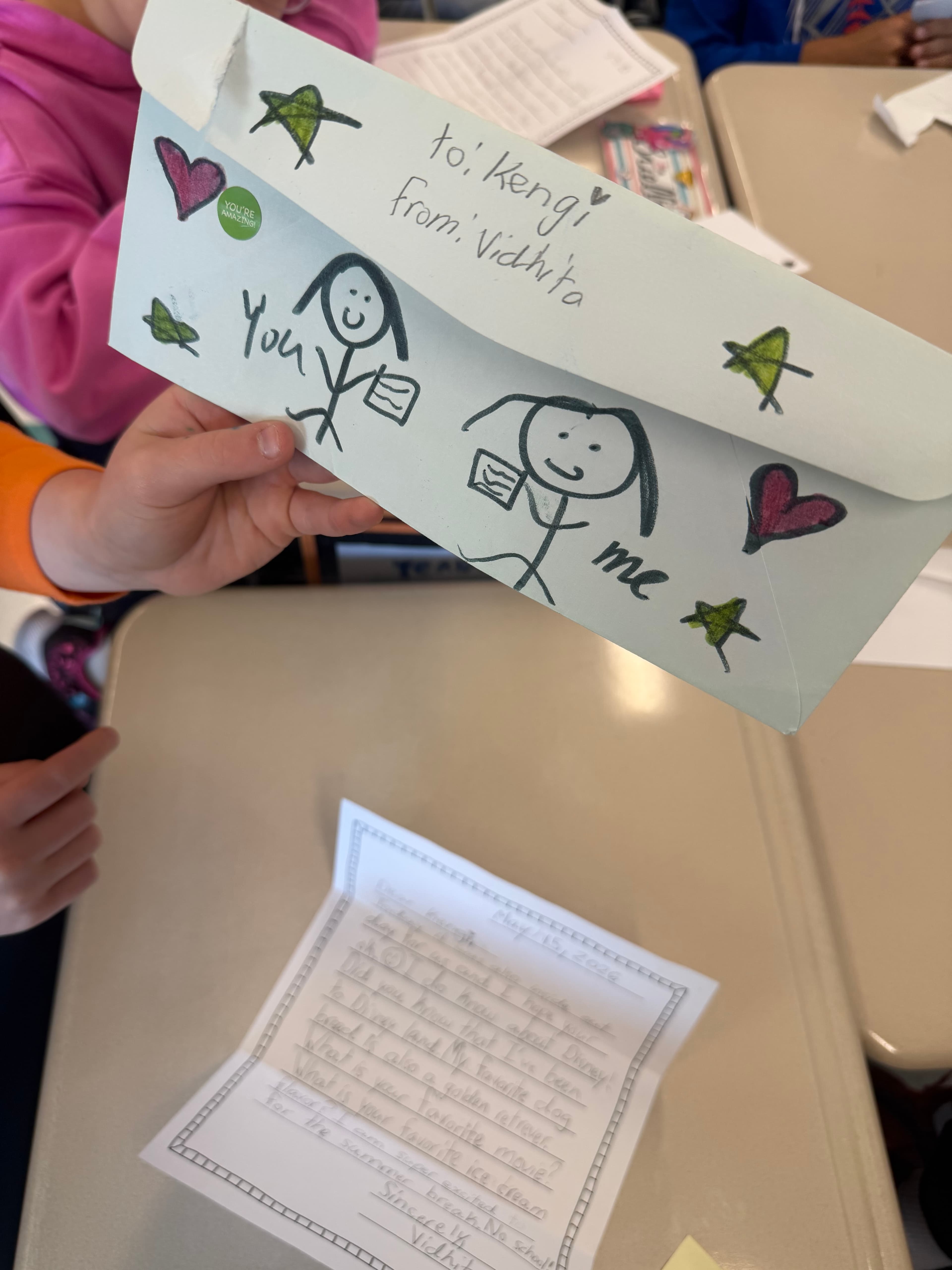 Kid holding a decorated envelope
